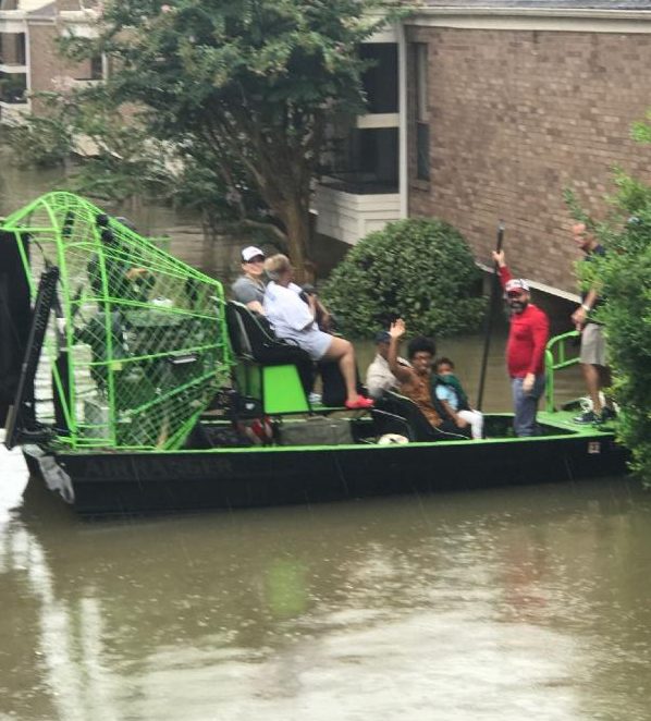 Family of Sonny Messiah-Jiles, Publisher of The Houston Defender, rescued by boat from their home as a result of rising flood waters in Houston. Photo: Clyde Jiles