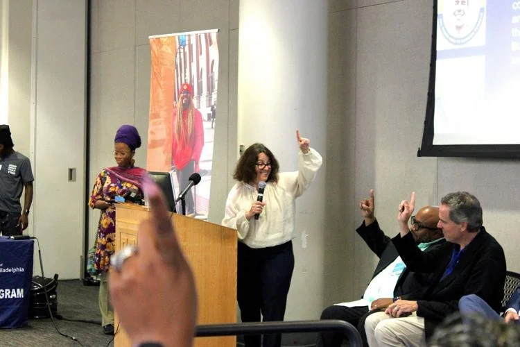 Alba Martinez, Director of Commerce for the City of Philadelphia, enthusiastically wraps up the introduction of the PHL Taking Care of Business program expansion, engaging the audience at Temple University’s Student Center Friday.