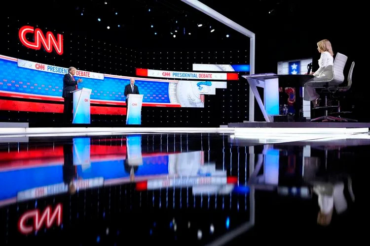 President Joe Biden, right, and Republican presidential candidate former President Donald Trump, left, during a presidential debate hosted by CNN, Thursday in Atlanta. On the far right is CNN moderator Dana Bash. —AP Photo/Gerald Herbert