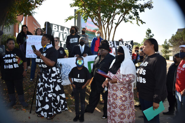 Nikia Faulk, left, speaks.