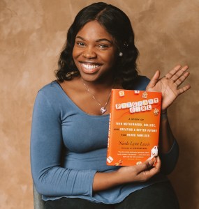 Briana Whitfield holds a copy of Generation Hope founder and CEO Nicole Lynn Lewis’ book “Pregnant Girl: A Story of Teen Motherhood, College and Creating a Better Future for Young Families.” (Courtesy photo)