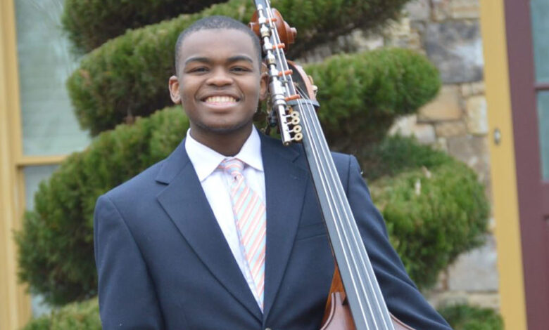 Tendekai Mawokomatanda with his bass. (Photo Credit: Photo Courtesy of Shongedzai Mawokomatanda)