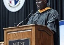 Tampa Bay Buccaneers head coach Todd Bowles speaks to the graduates and crowd at the 215th commencement exercise for of Mount St Mary's University, Saturday, May 13, 2023, in Emmitsburg, Md.. Bowles finished his degree in September of 2022 but wanted to walk the stage on Saturday. (Ric Dugan/The Frederick News-Post via AP)