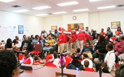 Students from after-school  enrichment project present Christmas program at school board gathering