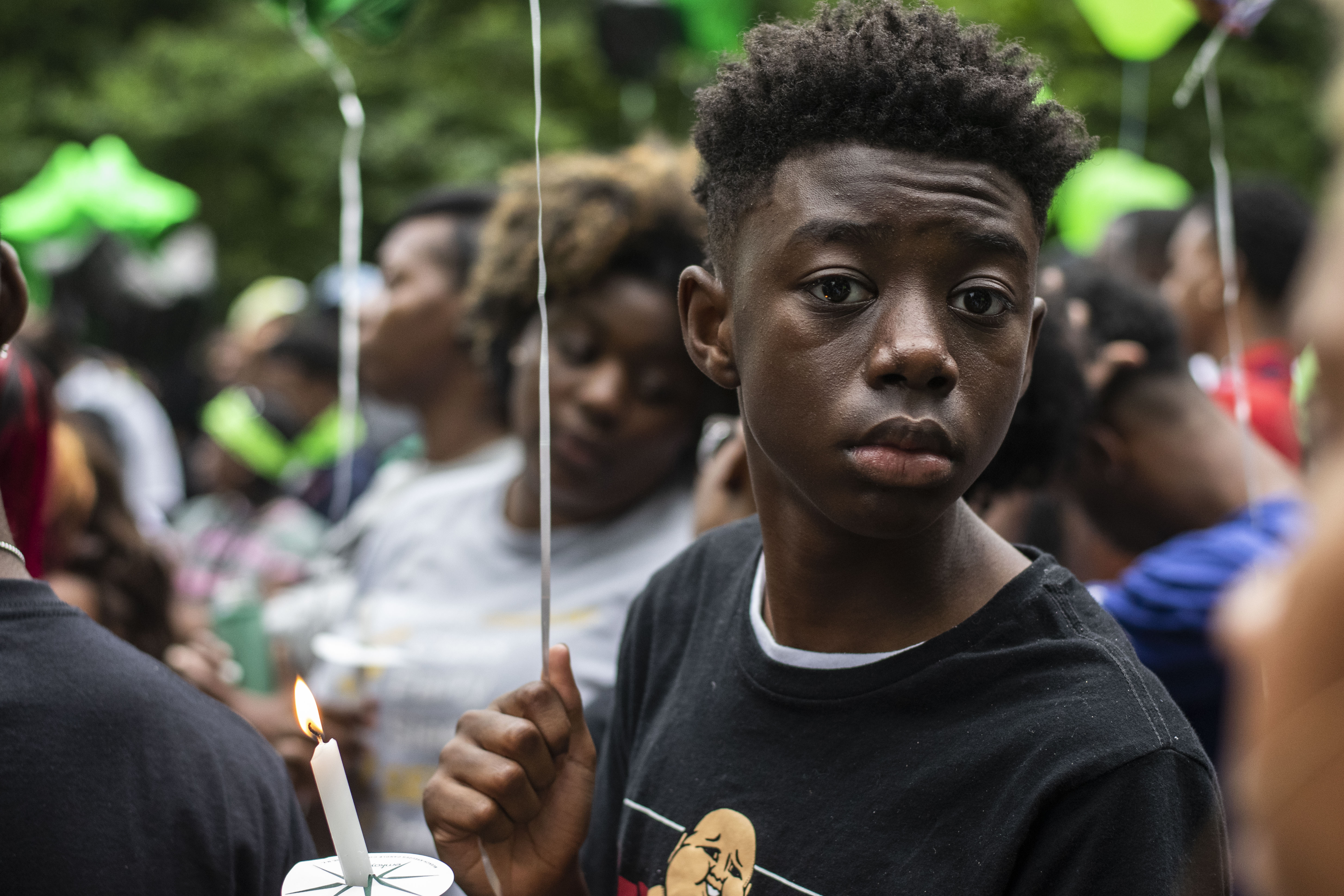 A vigil for Brandon Webber, who was shot by U.S. Marshals in Frayser, drew a crowd carrying candles and balloons last Friday evening (June 14). (Photo: Johnathan Martin)