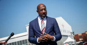 The competition between Senator Warnock and Walker is important because it impacts which party will drive policy in the U.S. Senate. (Photo: Senator Raphael Warnock at the Delta Flight Museum mass vaccination site / Flickr)