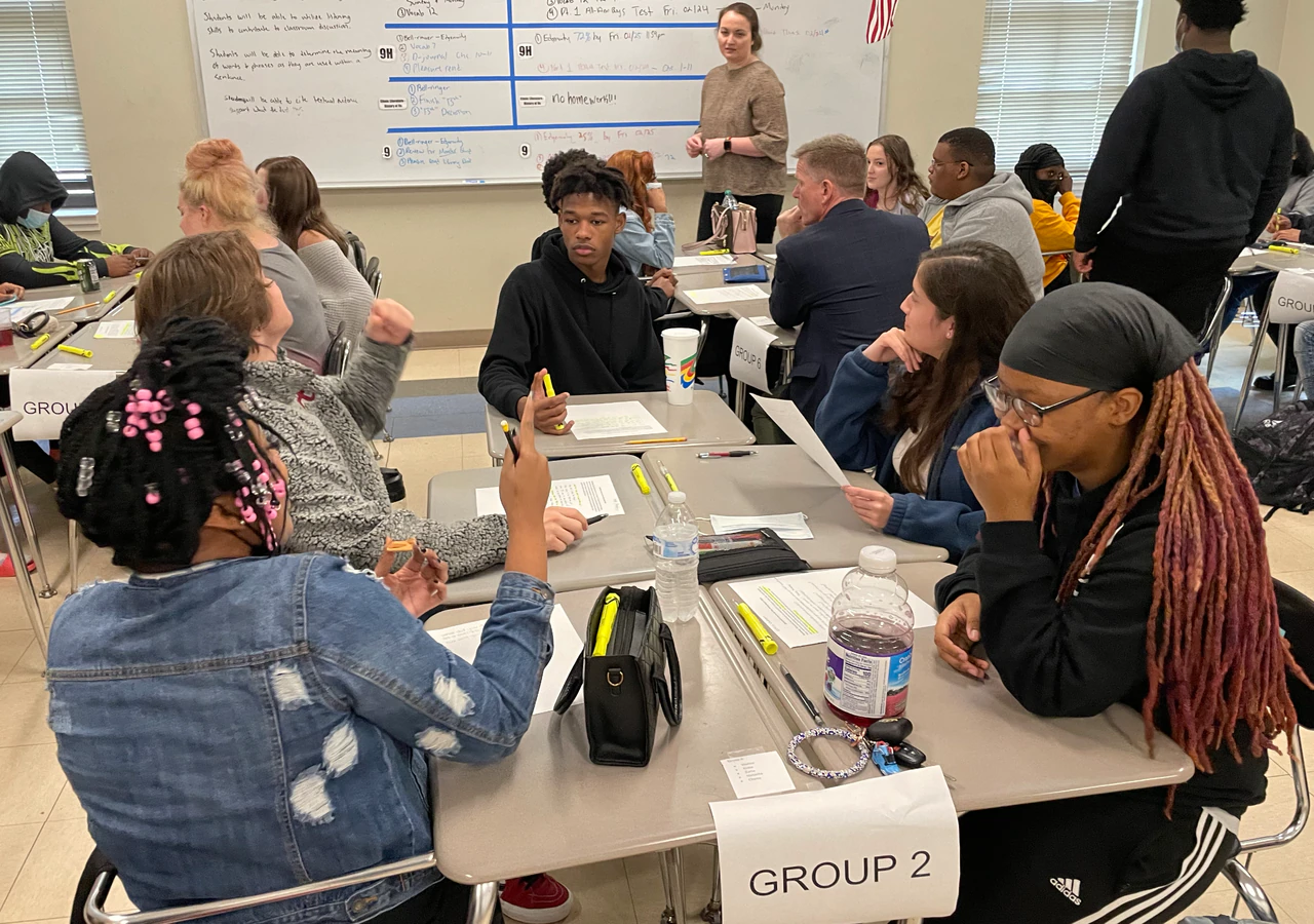 Students group around a classroom table at Northridge High School.