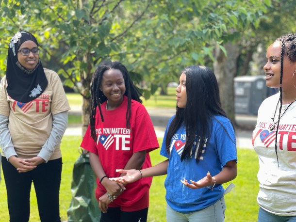 Jennifer Hernandez (in the blue) getting out the vote as part of her work with the MLK Freedom Center.