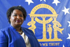 GOP attacks Georgia’s Abrams on voting as judge rejects suit