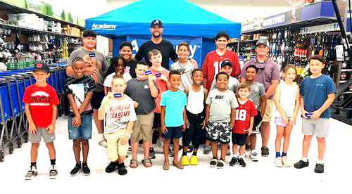 AJ McCarron, youngsters warm up for football camp by shopping