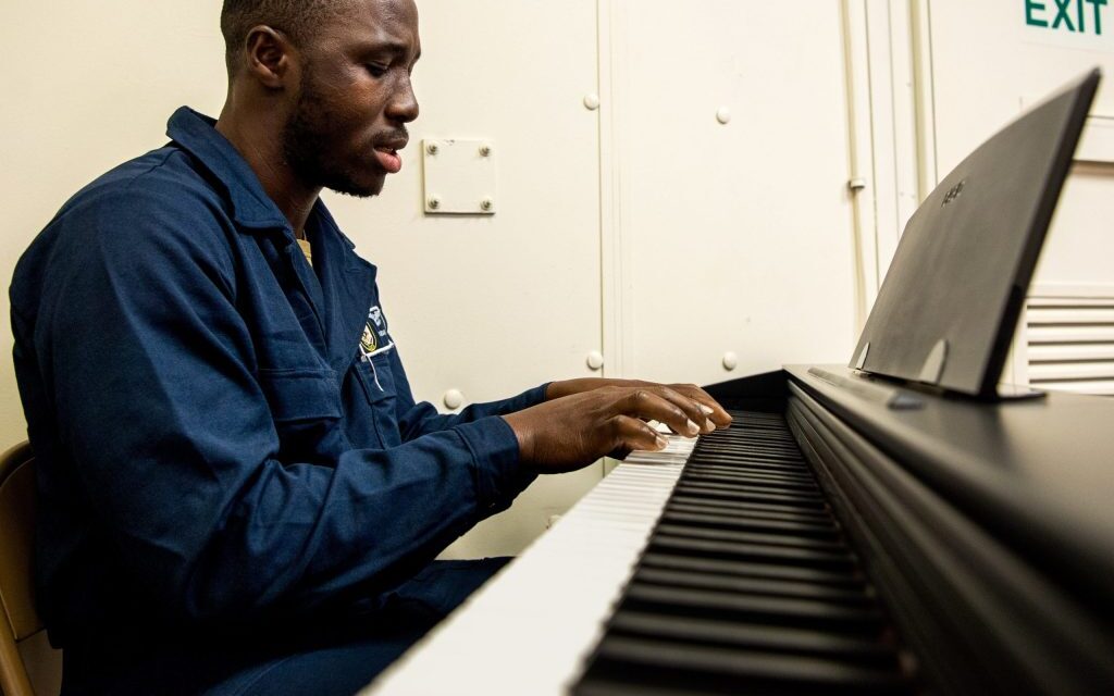 Baltimore native plays the piano aboard USS Boxer