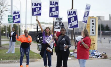 Workers strike at all 3 Detroit automakers, a new tactic to squeeze companies for better pay