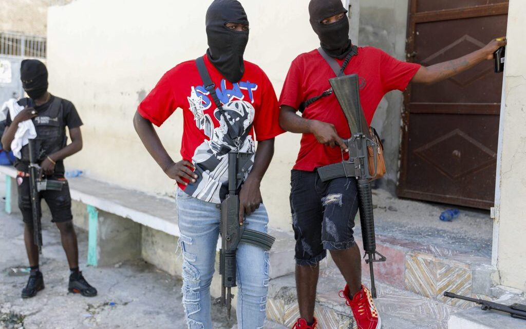 Politicians seek new alliances to lead Haiti as gangs take over and premier tries to return home