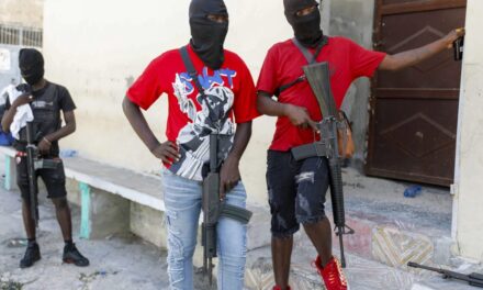 Politicians seek new alliances to lead Haiti as gangs take over and premier tries to return home