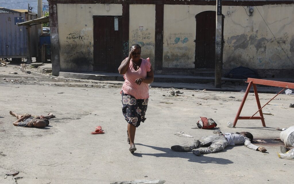 Hundreds of inmates flee after armed gangs storm Haiti’s main prison, leaving bodies behind