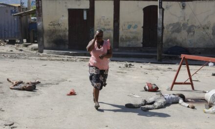 Hundreds of inmates flee after armed gangs storm Haiti’s main prison, leaving bodies behind