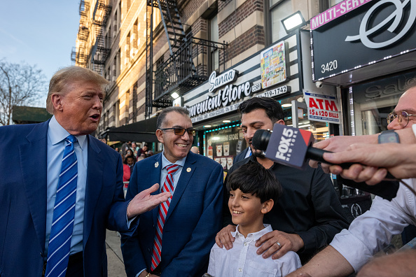 Trump made a scripted visit to Harlem, signaling to Black voters. But the owner of the bodega he visited killed a Black man two years ago.