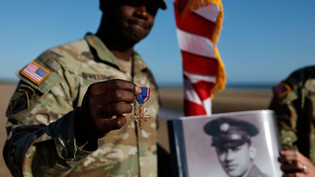 Black D-Day combat medic’s long-denied medal tenderly laid on Omaha Beach where he bled, saved lives