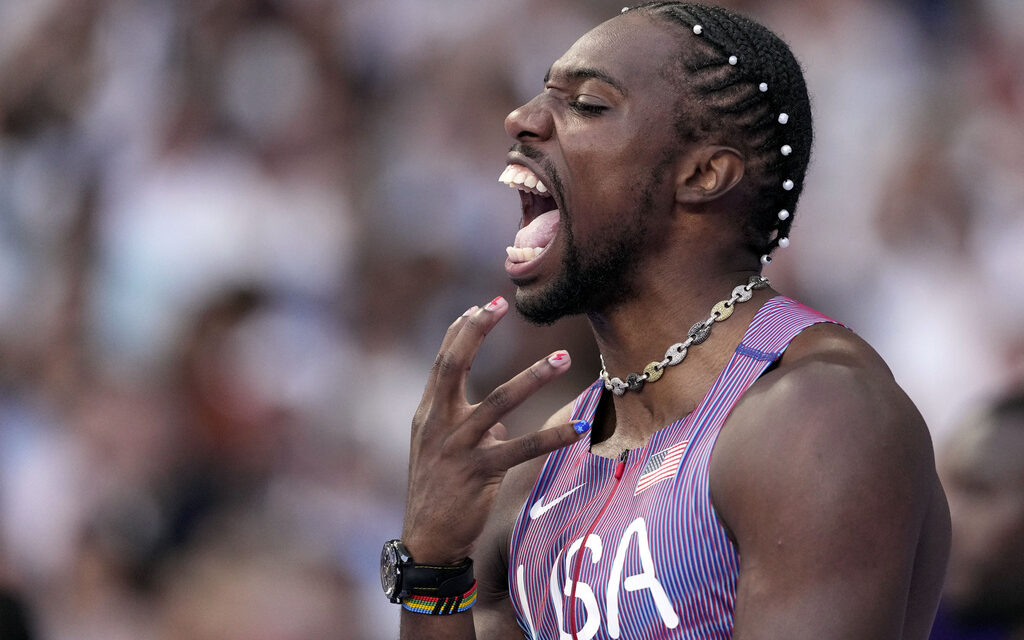 Noah Lyles pulls out Olympic 100 by five-thousandths of a second