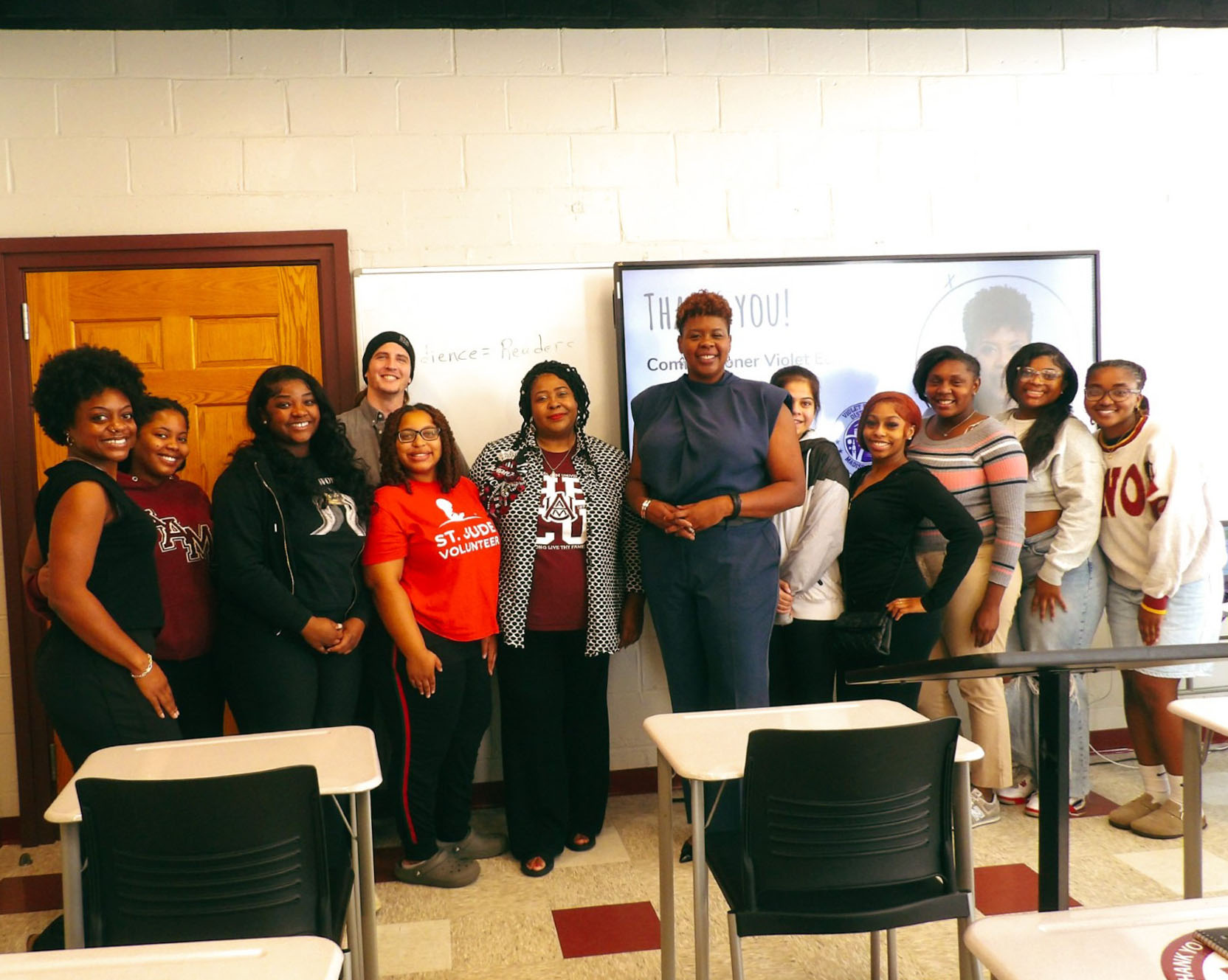 Commissioner Edwards poses with students in Fall 2024 Journalism Workshop Class