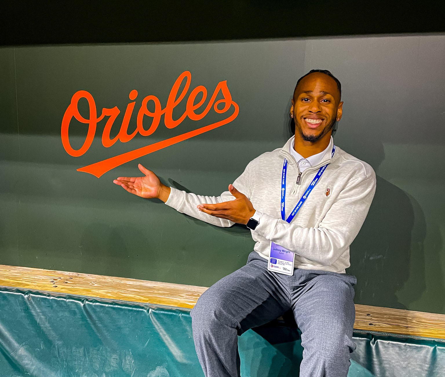 Wright Poses By Orioles sign in the dugout at Oriole Park at Camden Yards