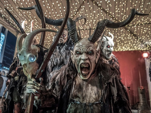 Krampus with mask, horns and fur clothing at the Christmas Market, Leoben, Styria, Austria