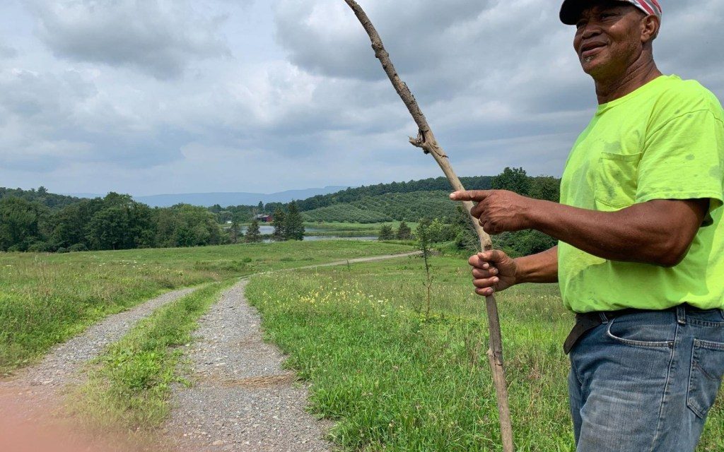 Facing fire and funding cuts, farmer fights to save his land